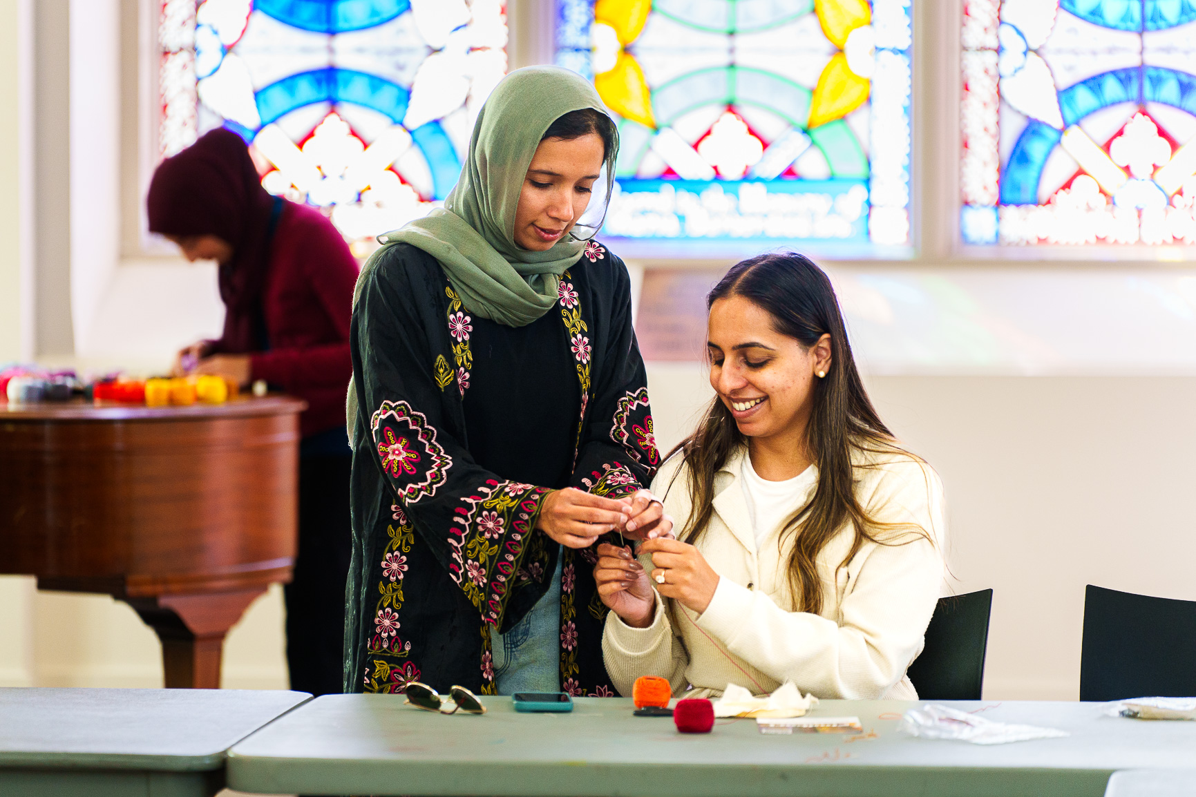 Two women working on embroidery 