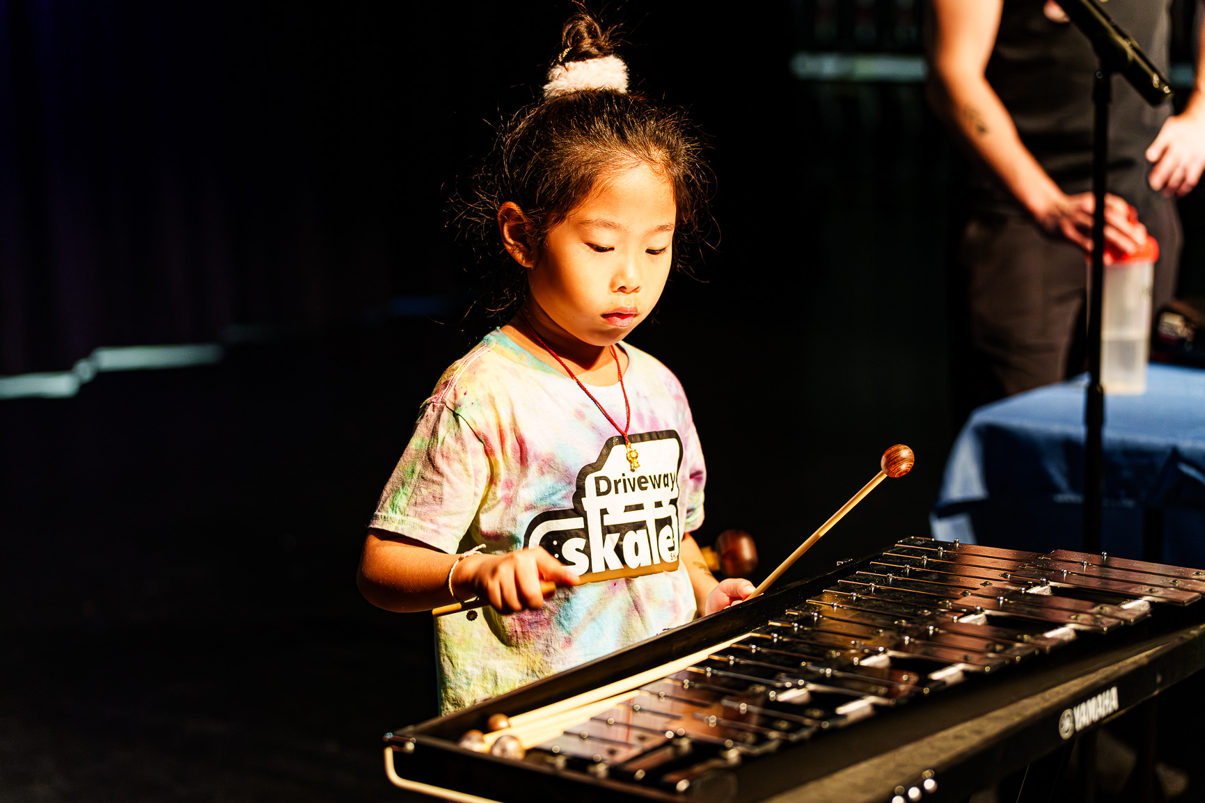 Kid playing xylophone