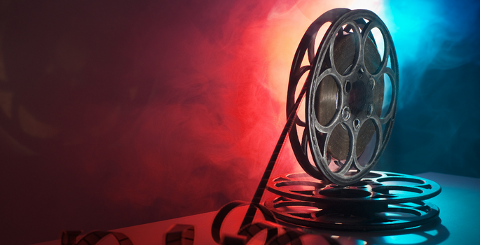 Film reel on red and blue background