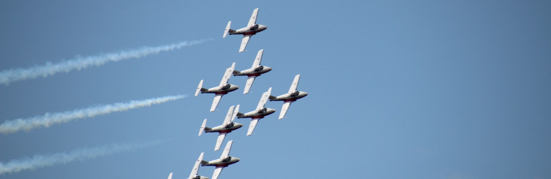 Snowbird planes flying over on blue sky