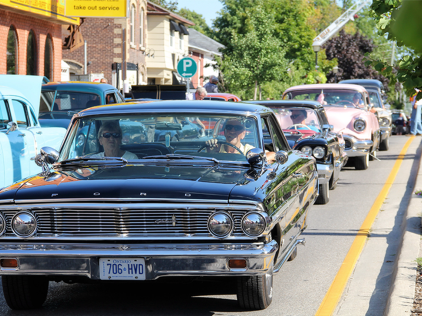 Classic car driving on road