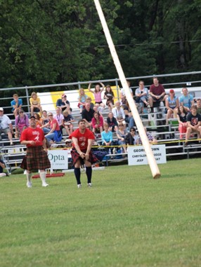 man throwing log for sport