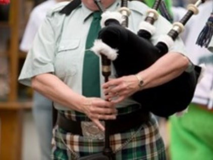 person holding bagpipes