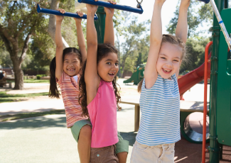 3 girls on the monkey bars