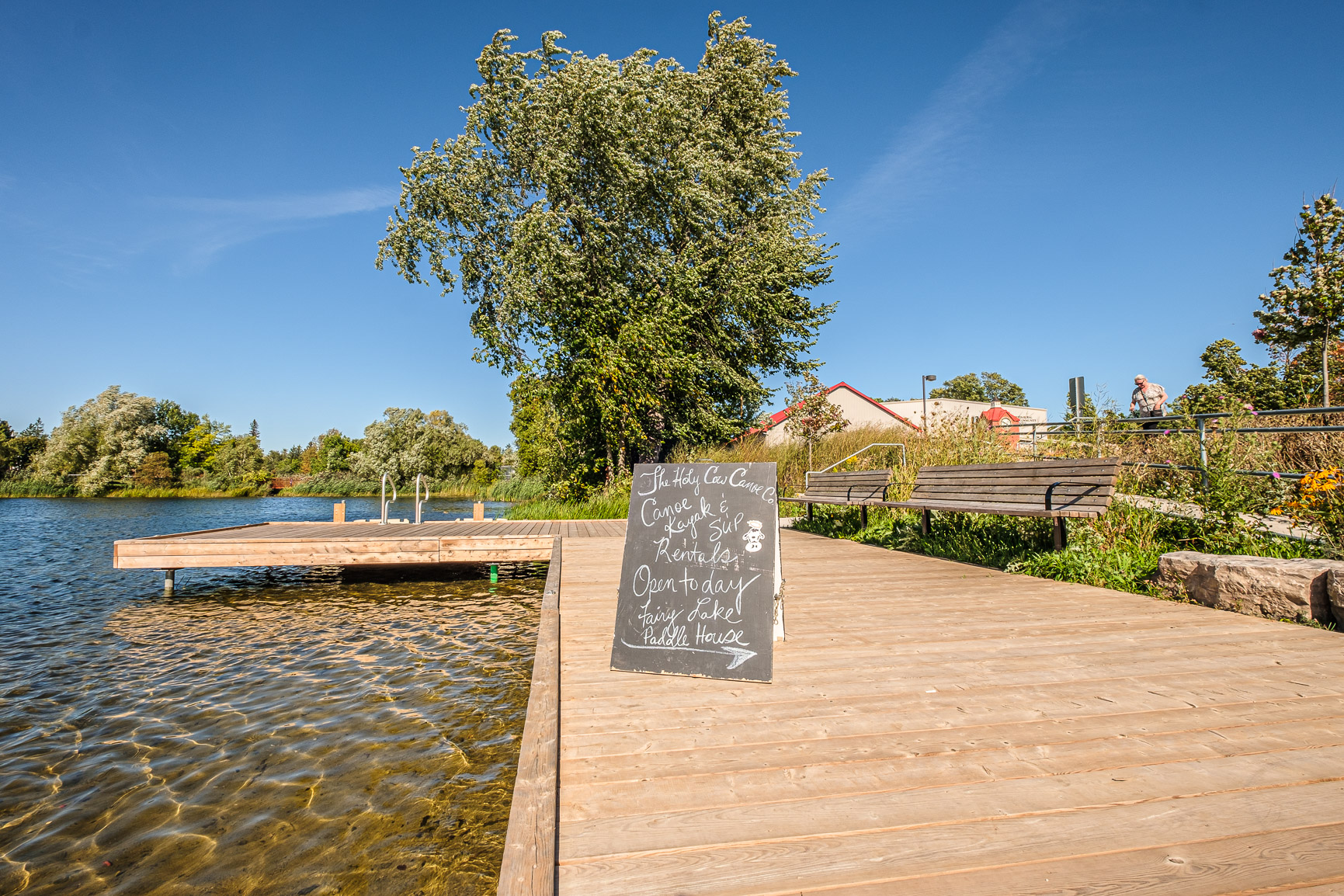 sign on dock in front of water