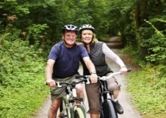 couple biking on a trail