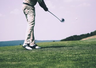 Golfer hitting a ball