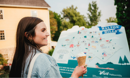 A woman holding an ice cream cone