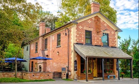 outdoor image of old brick house converted into a restaurant